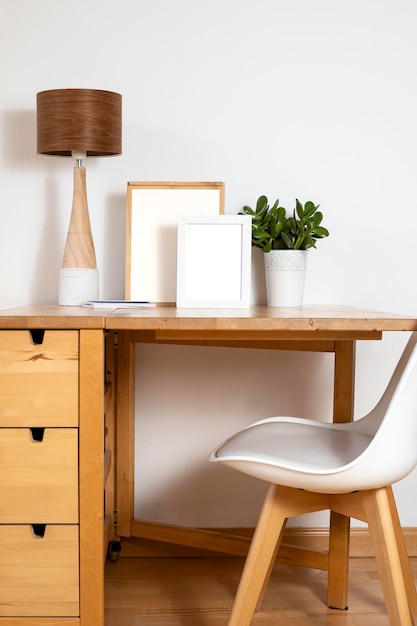 Arrangement of white empty frames on table