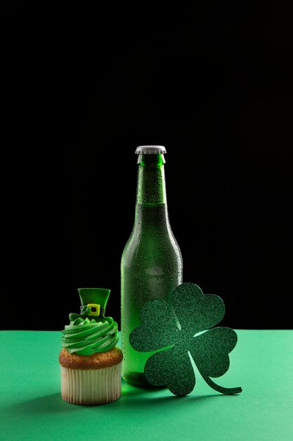 Arrangement with beer bottle, cupcake and clover