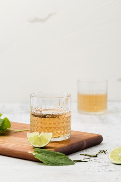 Arrangement with beverage and cutting board