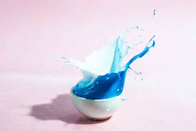 Free photo arrangement with blue paint splash