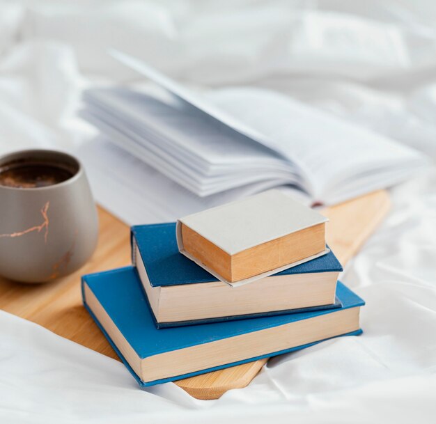 Arrangement with books in bed