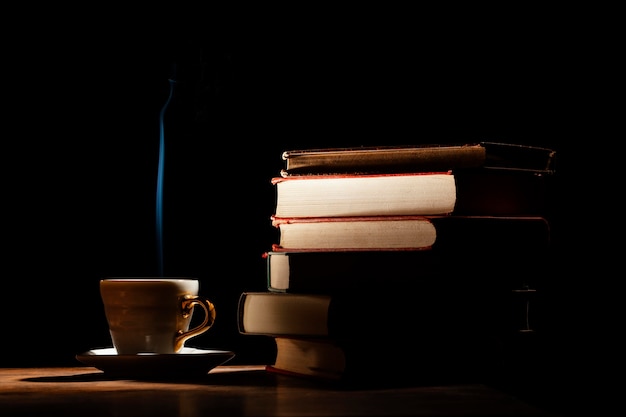 Arrangement with books and dark background