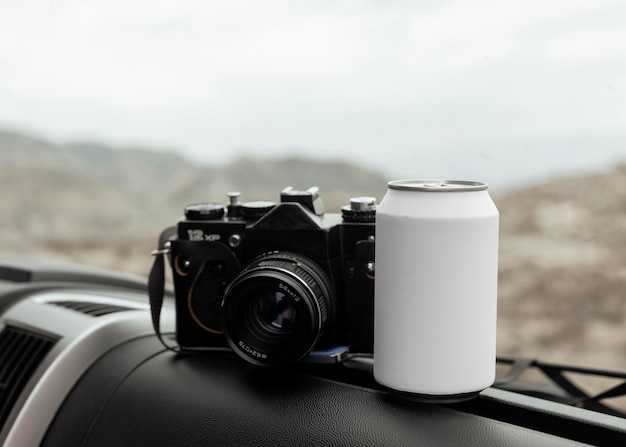 Free photo arrangement with camera and can in car