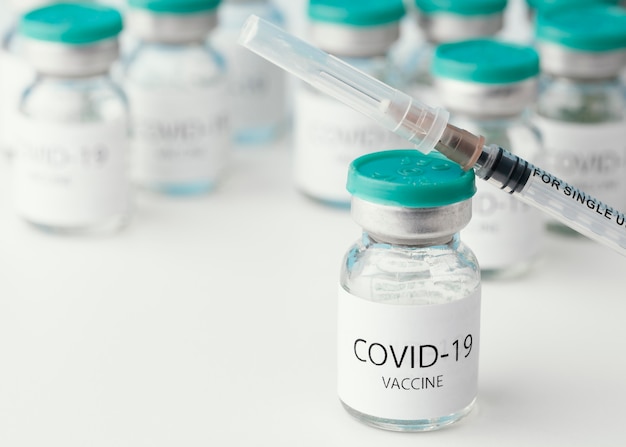 Arrangement with coronavirus vaccine bottle