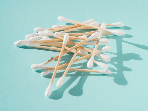 Arrangement with cotton buds on blue background