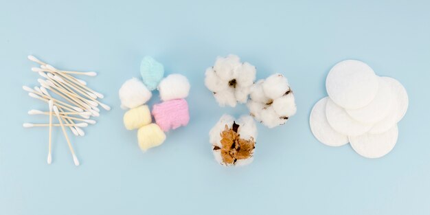 Arrangement with cotton items on blue background