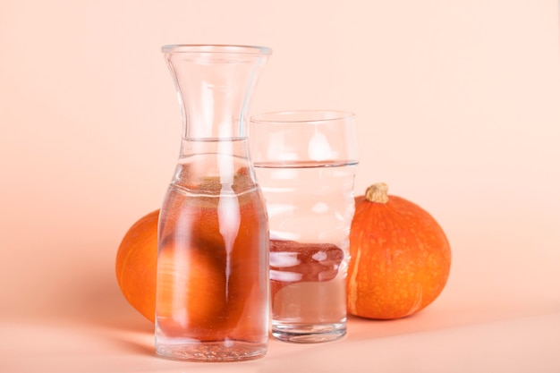 Arrangement with different sized glasses and pumpkins