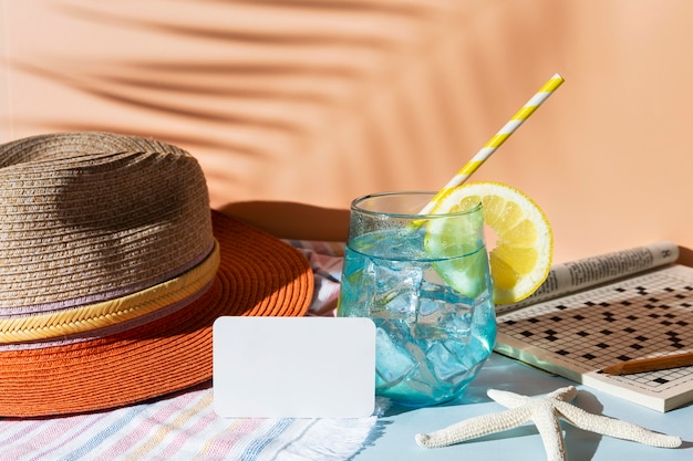 Arrangement with drink and hat