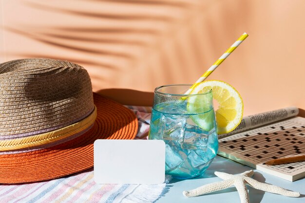 Arrangement with drink and hat