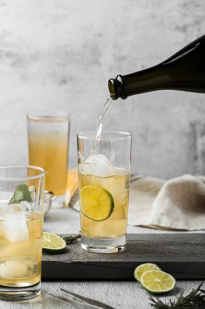 Arrangement with drink pouring in glass