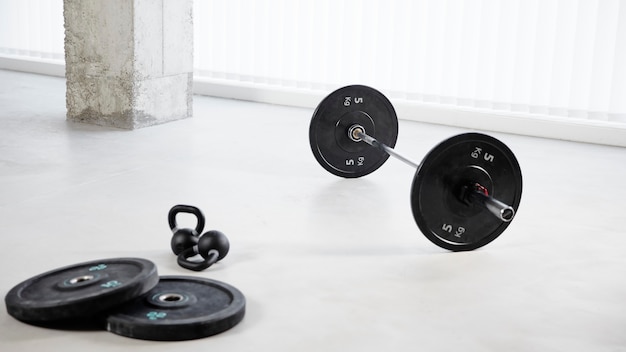 Free photo arrangement with dumbbells on floor