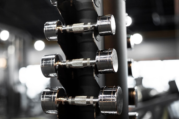 Arrangement with dumbbells at gym