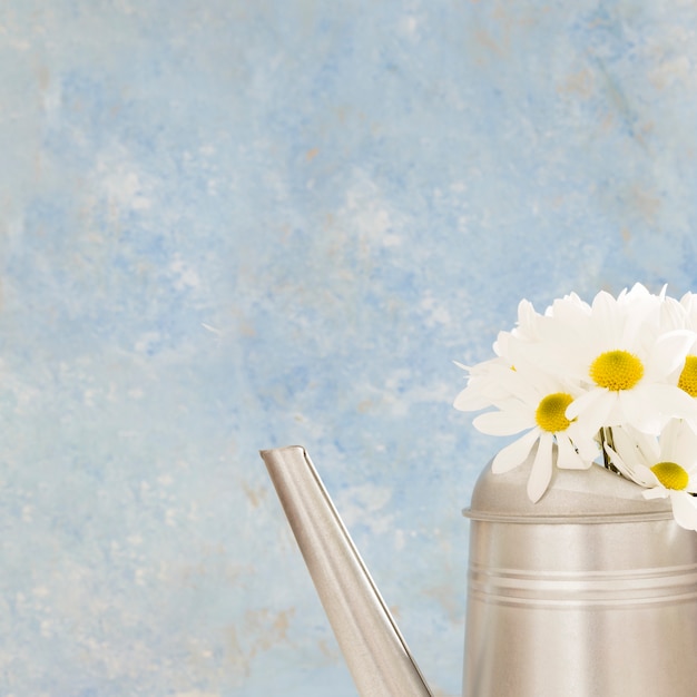 Free photo arrangement with flowers in a watering can