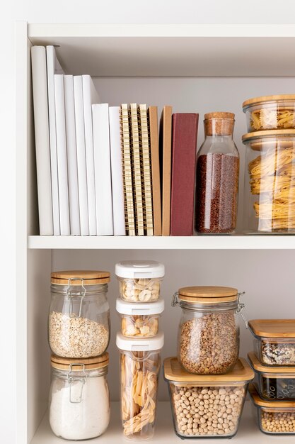 Arrangement with food containers and books