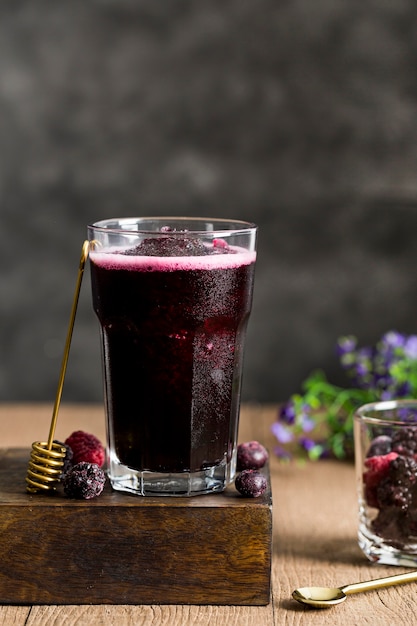 Arrangement with forest fruits smoothie