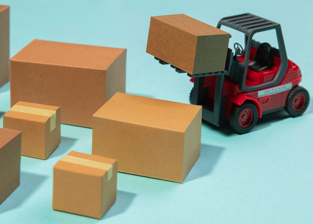 Free photo arrangement with forklift and boxes