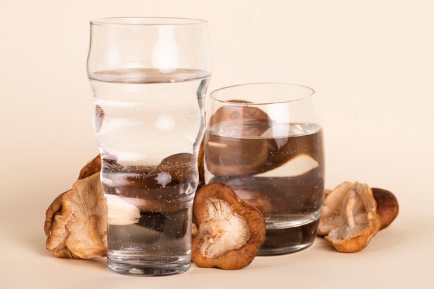Arrangement with fresh mushrooms and water