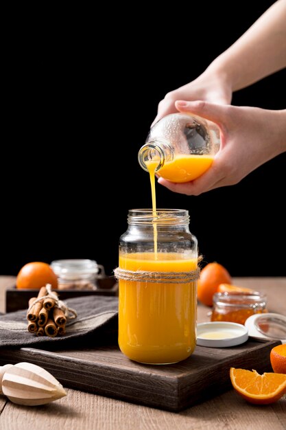 Arrangement with fresh orange smoothie