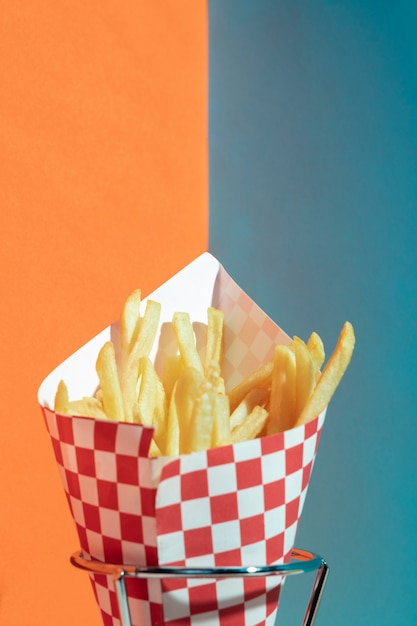 Arrangement with fries potatoes on stand 