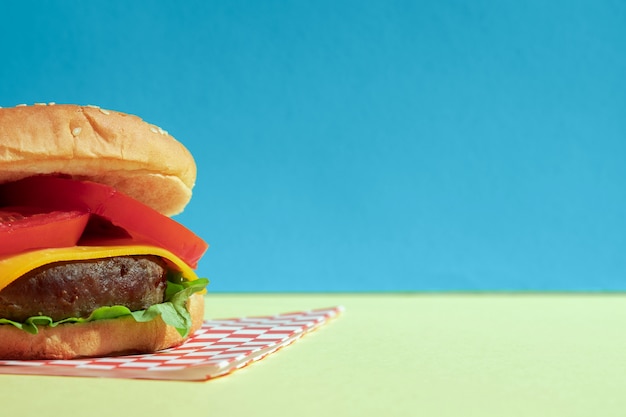 Arrangement with half burger and blue background