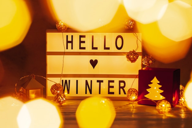 Free photo arrangement with hello winter sign and lights