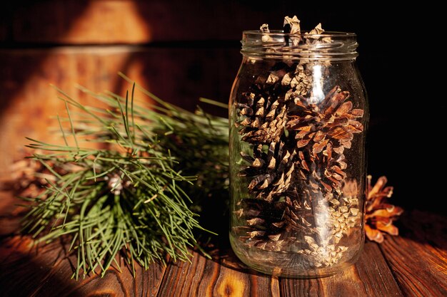 Arrangement with jar filled with cones