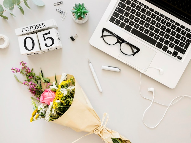 Arrangement with laptop and flowers