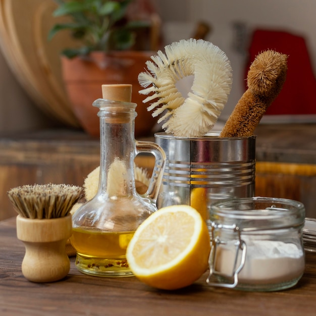 Free photo arrangement with lemons and cleaning items