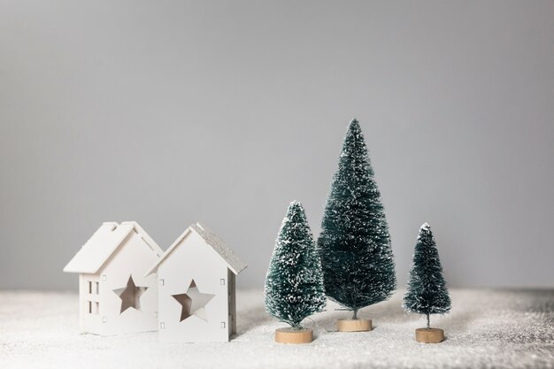 Arrangement with little christmas trees and houses