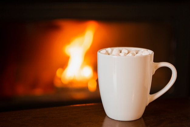 Arrangement with marshmallow drink near the fireplace