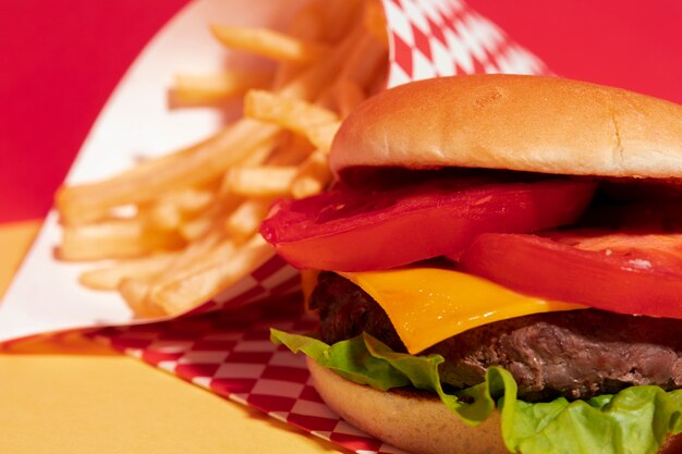 Arrangement with meat burger and fries