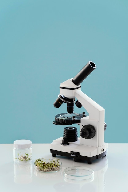 Free photo arrangement with microscope and plants