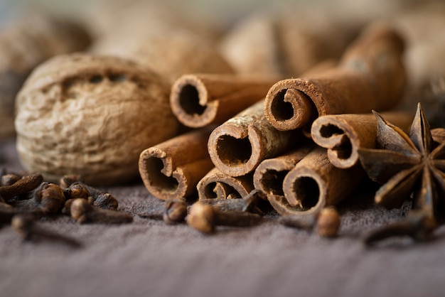 Arrangement with nuts and cinnamon sticks