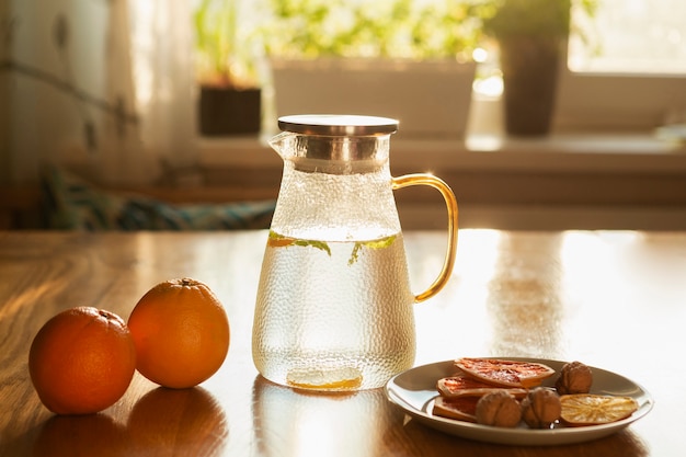 Arrangement with oranges and water bottle