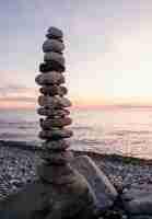 Free photo arrangement with pebbles at seaside