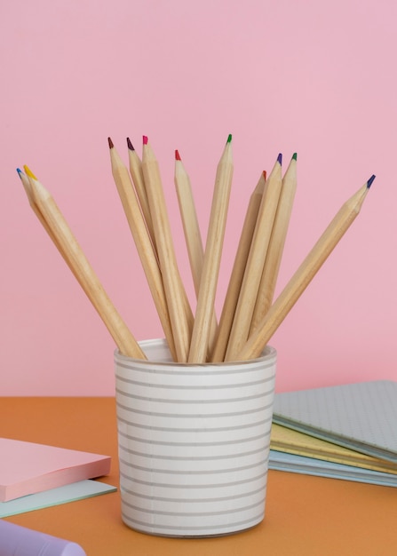 Arrangement with pencils in cup