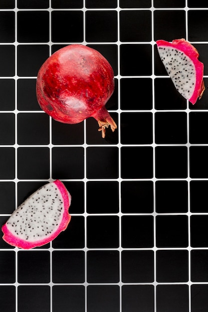 Free photo arrangement with pomegranate on black background