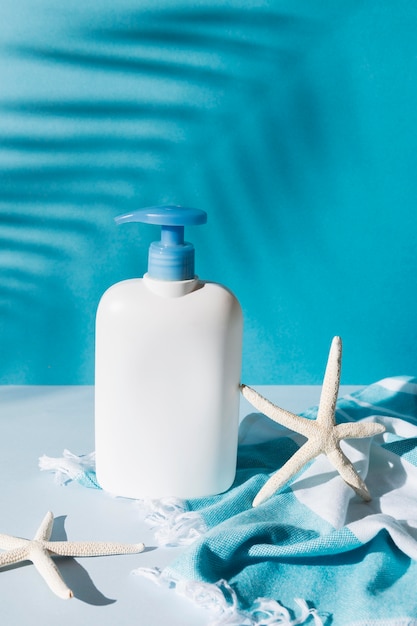 Free photo arrangement with soap container and starfish