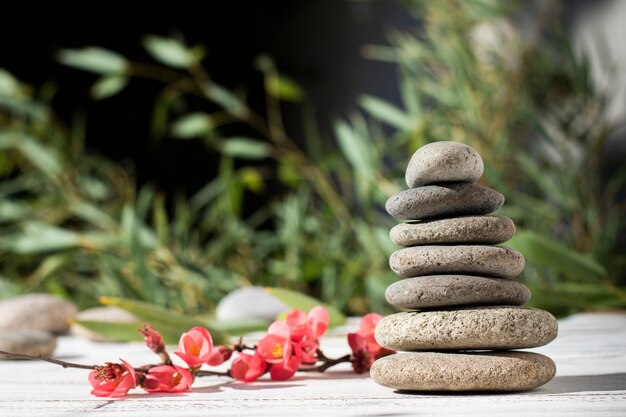 Arrangement with spa stones and flowers outdoors