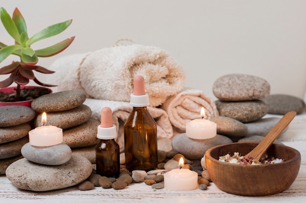 Arrangement with spa stones and lit candles