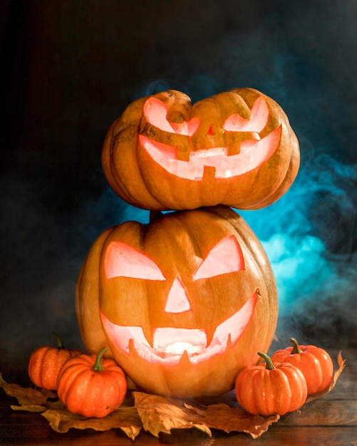 Arrangement with spooky carved pumpkins