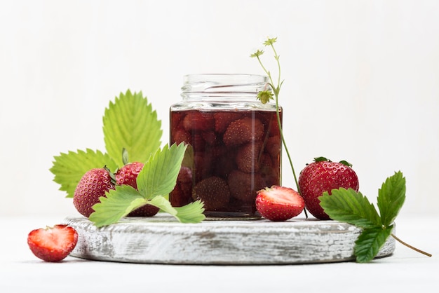 Arrangement with strawberries in jar