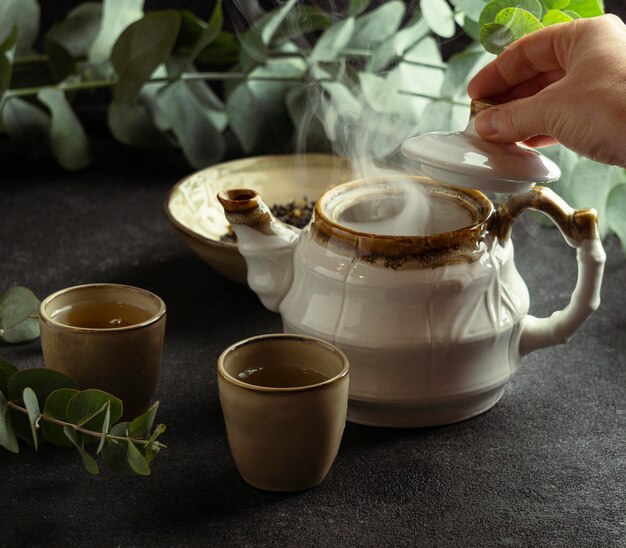 arrangement with teacup and hot tea