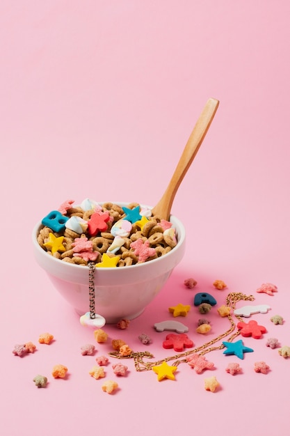 Arrangement with white bowl for cereals and spoon