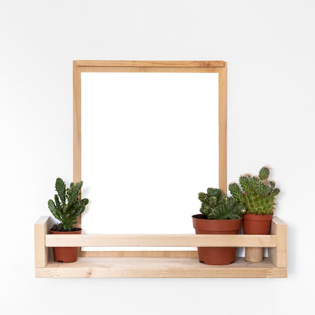 Arrangement of wooden empty frame on table