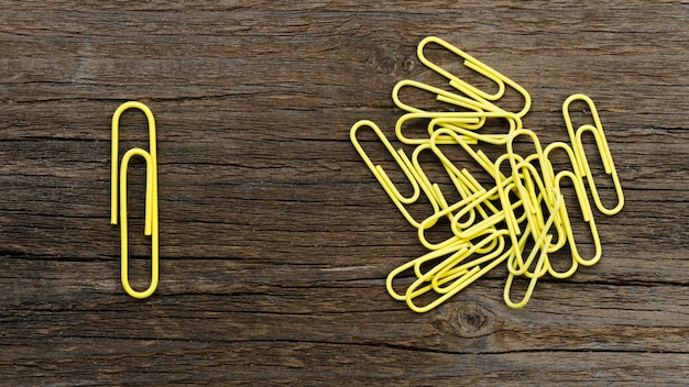 Arrangement of yellow paper clips for individuality concept