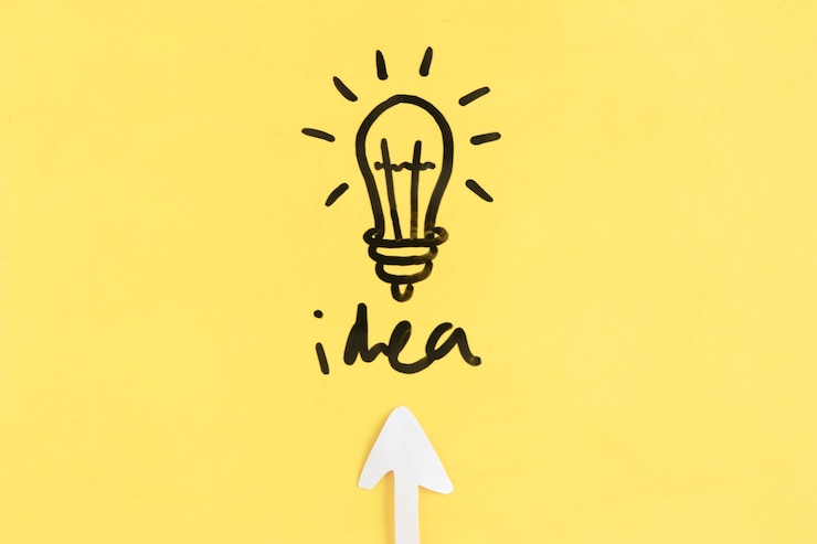 Free Photo arrow symbol directing towards light bulb with idea word