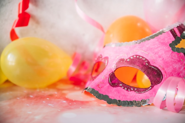 Art mask with balloons and ribbons