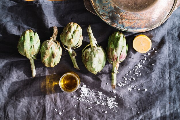 Artichokes near salt and lemon