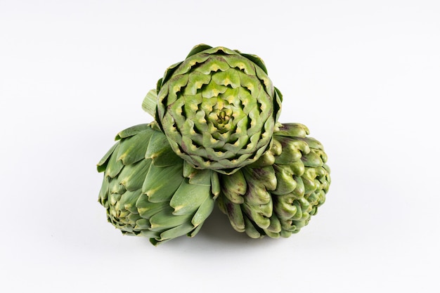 Artichokes with high angle view on a white 